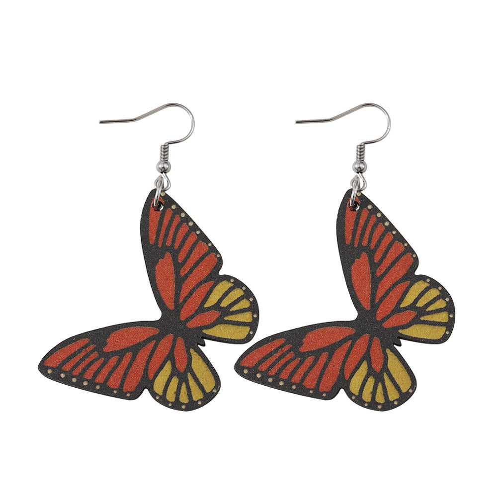 Alas de mariposa al por mayor Pendientes de madera de doble cara